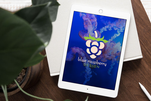 blue raspberry design logo on an ipad